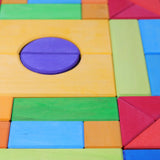 Grimm's Basic Building Set 2 wooden block set showing close up of wood grain detail on the individual blocks in a rainbow palette 