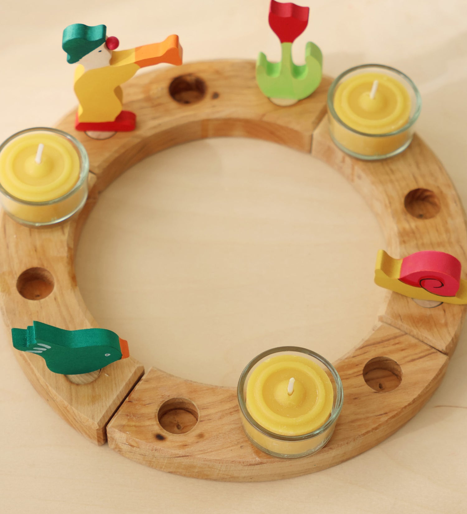 A celebration ring with the Grimm's beeswax candles and tealight holders.