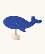 Grimm's handcrafted wooden blue whale decorative figure with a unpainted stand and painted eyes