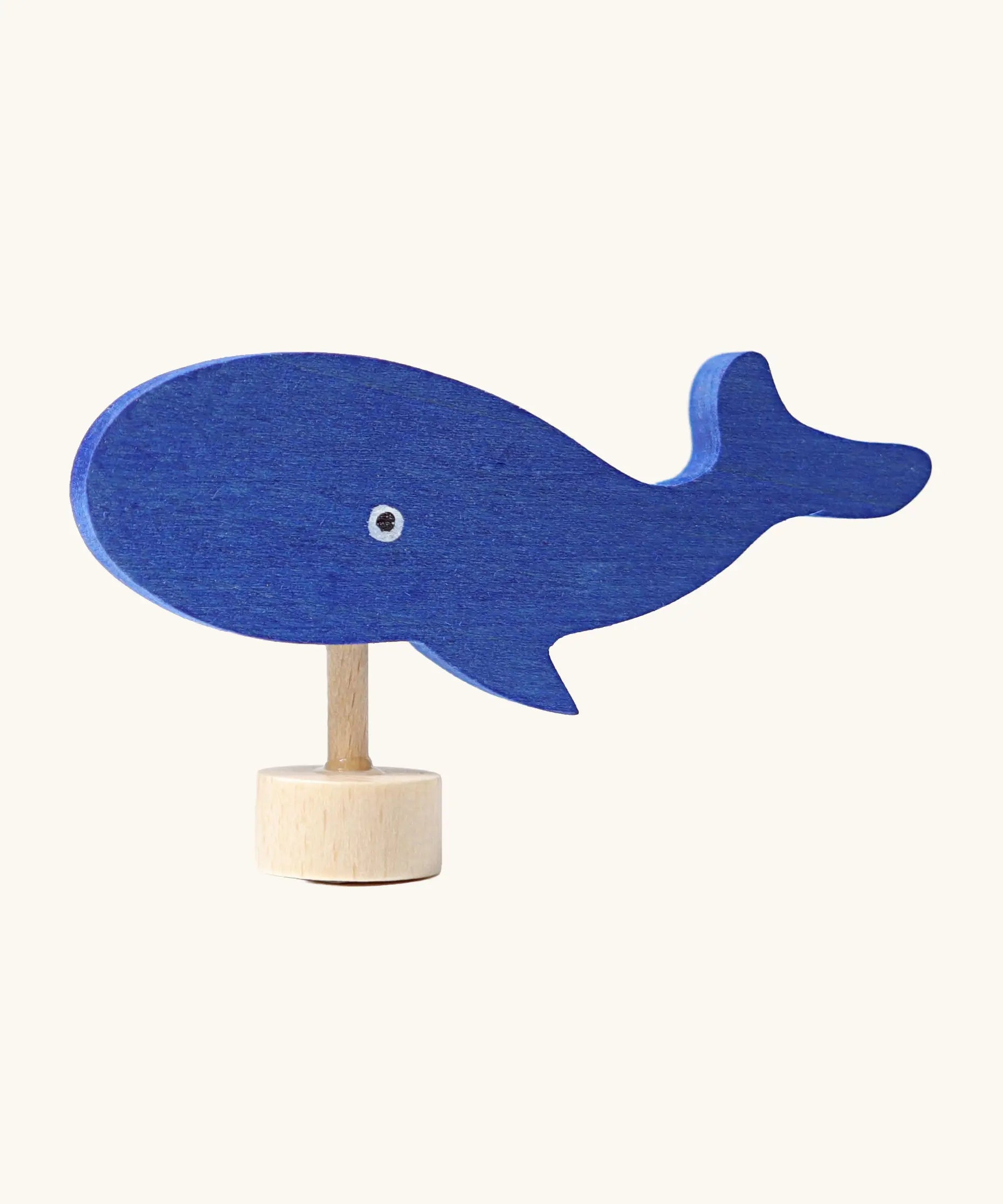 Grimm's handcrafted wooden blue whale decorative figure with a unpainted stand and painted eyes