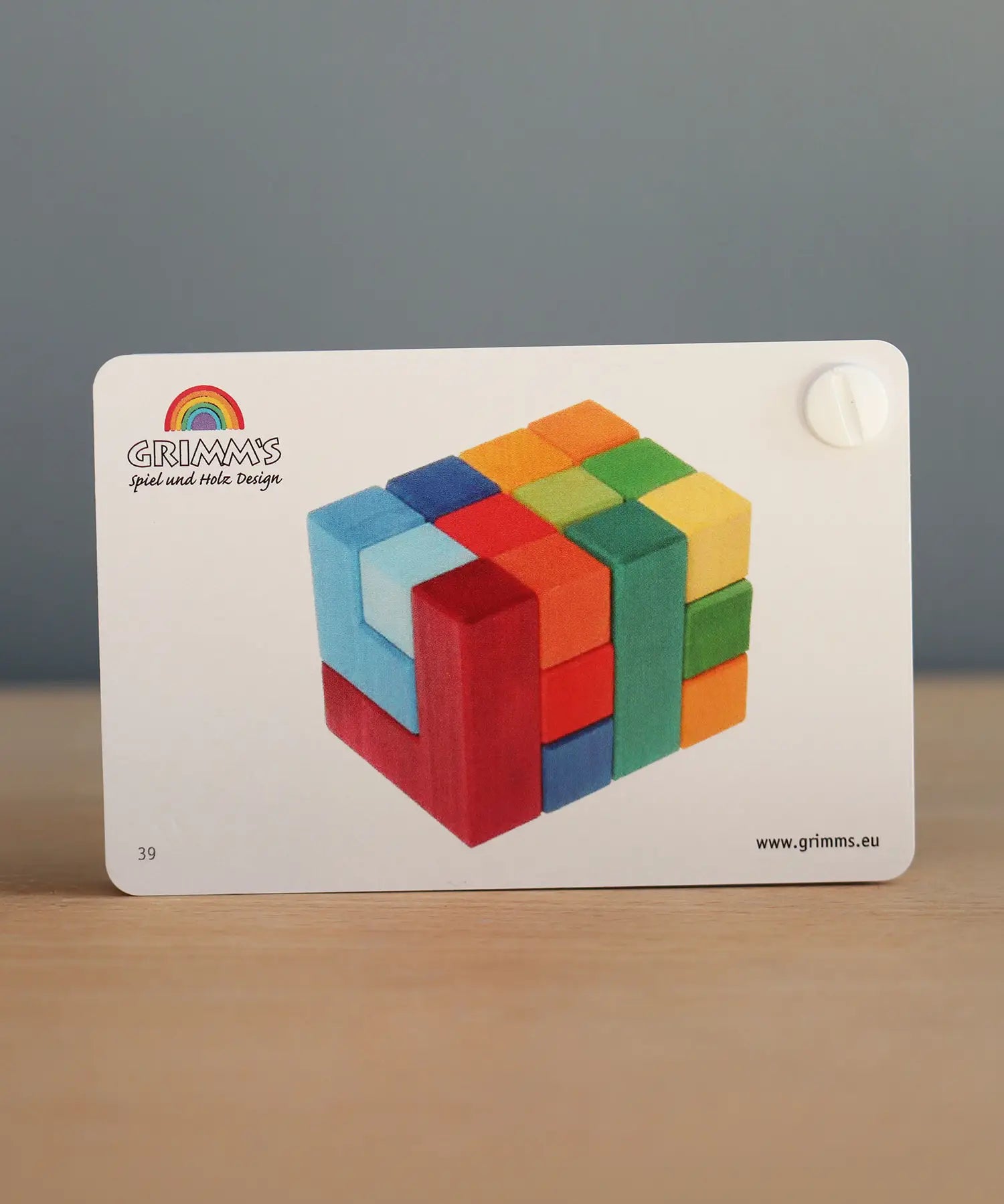 Front of the Grimm's puzzle square booklet showing a template builds from the creative square set 