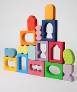 The blocks from the Grimm's Windows Building Set wooden blocks placed in a stack on top of each other. These Grimm's wooden blocks are part of a wide range of wooden toys available here at Babipur. 