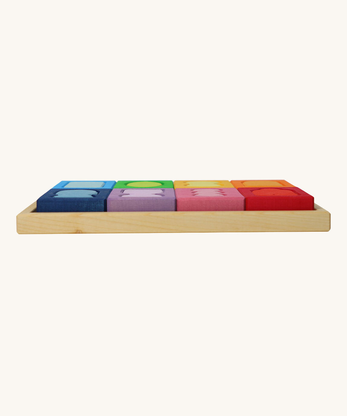 A side view of the Grimm's Windows Building Set wooden blocksin their tray. These Grimm's wooden blocks are part of a wide range of wooden toys available here at Babipur. 