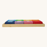 A side view of the Grimm's Windows Building Set wooden blocksin their tray. These Grimm's wooden blocks are part of a wide range of wooden toys available here at Babipur. 