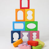 The blocks from the Grimm's Windows Building Set wooden blocks placed in a stack on top of each other. These Grimm's wooden blocks are part of a wide range of wooden toys available here at Babipur. 
