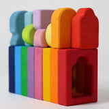 The windows and shaped from the Grimm's Windows Building Set wooden blocks all lined up. These Grimm's wooden blocks are part of a wide range of wooden toys available here at Babipur. 