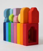 The windows and shaped from the Grimm's Windows Building Set wooden blocks all lined up. These Grimm's wooden blocks are part of a wide range of wooden toys available here at Babipur. 
