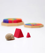 Close up of the large and small Grimm's Building Octagon Puzzle pieces next to each other.