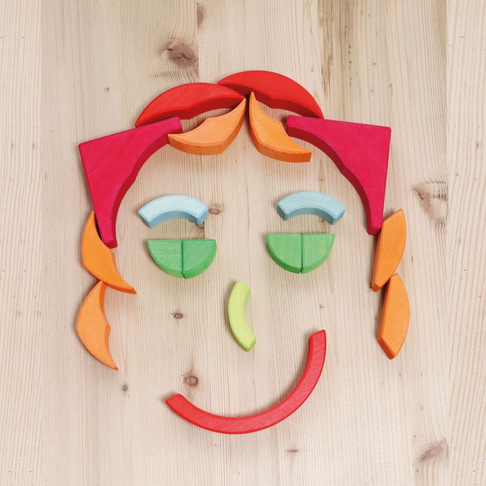 Grimm's Arcs in Squares Wooden Building Set blocks used to create a face.