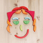 Grimm's Arcs in Squares Wooden Building Set blocks used to create a face.