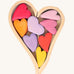 Grimm's Building Set Red Hearts. A wooden heart shaped frame with wooden hearts inside.