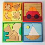 Four Grimm's building sets. Four different sets each containing a set of shaped blocks that sit in a coloured wooden storage tray. These Grimm's toys are part of a wide range of wooden toys available here at Babipur. 