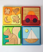 Four Grimm's building sets. Four different sets each containing a set of shaped blocks that sit in a coloured wooden storage tray. These Grimm's toys are part of a wide range of wooden toys available here at Babipur. 