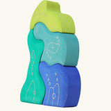 Side of the Grimm's casa aqua wooden toy stacking puzzle. Four piece simple wooden block puzzle toy in a mix of blue and green colours. 