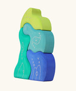 Side of the Grimm's casa aqua wooden toy stacking puzzle. Four piece simple wooden block puzzle toy in a mix of blue and green colours. 
