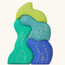 Grimm's casa aqua wooden toy stacking puzzle. Four piece simple wooden block puzzle toy in a mix of blue and green colours. 
