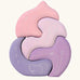 Grimm's casa coral wooden toy stacking puzzle. Four piece pink and lilac block puzzle.