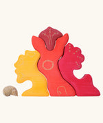 Grimm's casa glora wooden toy stacking puzzle. 4 piece puzzle in a mix of red and yellow colours.