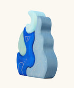 Side of Grimm's casa luna wooden stacking puzzle toy. Simple 4 piece blue blocks stacking toy. 