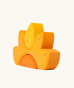 Side view of the Grimm's casa sole sun shaped wooden stacking toy. Three piece puzzle.