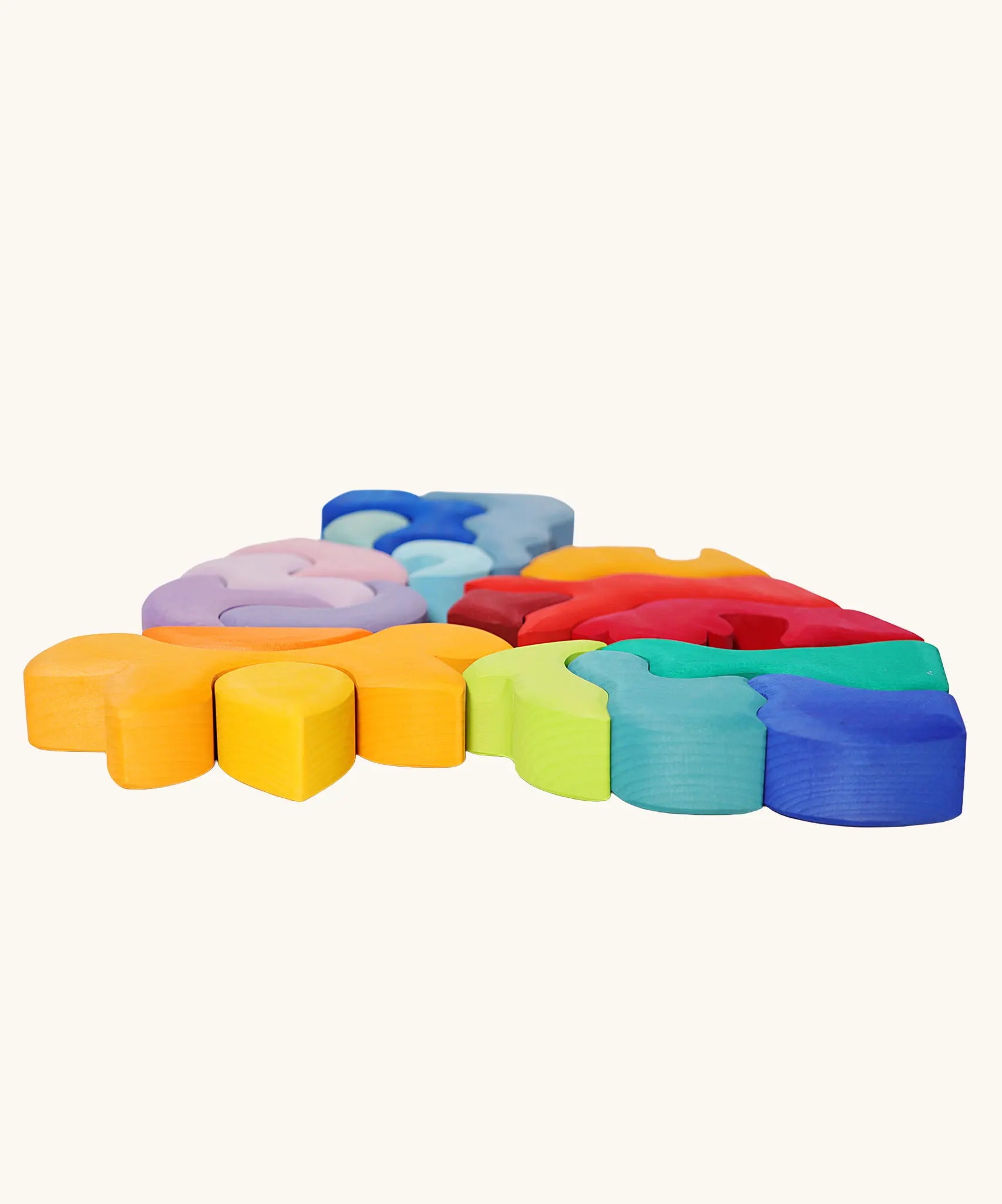 Collection of Grimm's casa wooden stacking puzzle toys laid flat. 