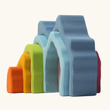 Side view of Grimm's cave arch stacker pastel wooden toy.