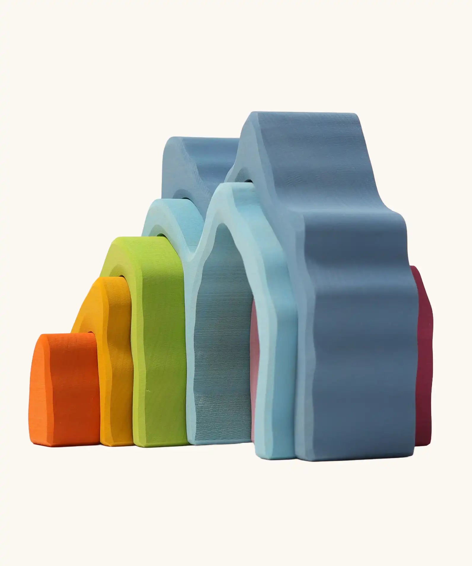 Side view of Grimm's cave arch stacker pastel wooden toy.