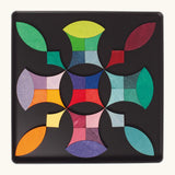 A abstract shape using the Grimm's bright wooden circular magnetic pieces displayed in a tin 