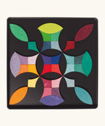 A abstract shape using the Grimm's bright wooden circular magnetic pieces displayed in a tin 
