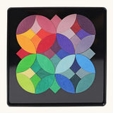 Grimms circles magnet puzzle set. Includes 40 plywood magnetic pieces in bright colours and a storage tin