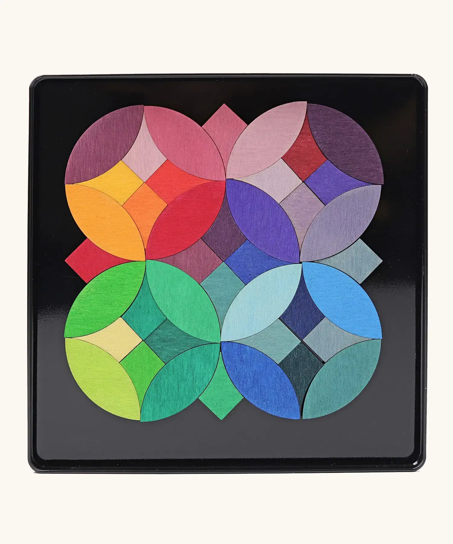 Grimms circles magnet puzzle set. Includes 40 plywood magnetic pieces in bright colours and a storage tin
