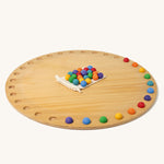 Grimm's Circular Disc & 35 Marbles on a plain background. 