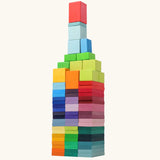Tower built from the Grimm's colour charts rally wooden toy set. 74 piece rainbow coloured block set.