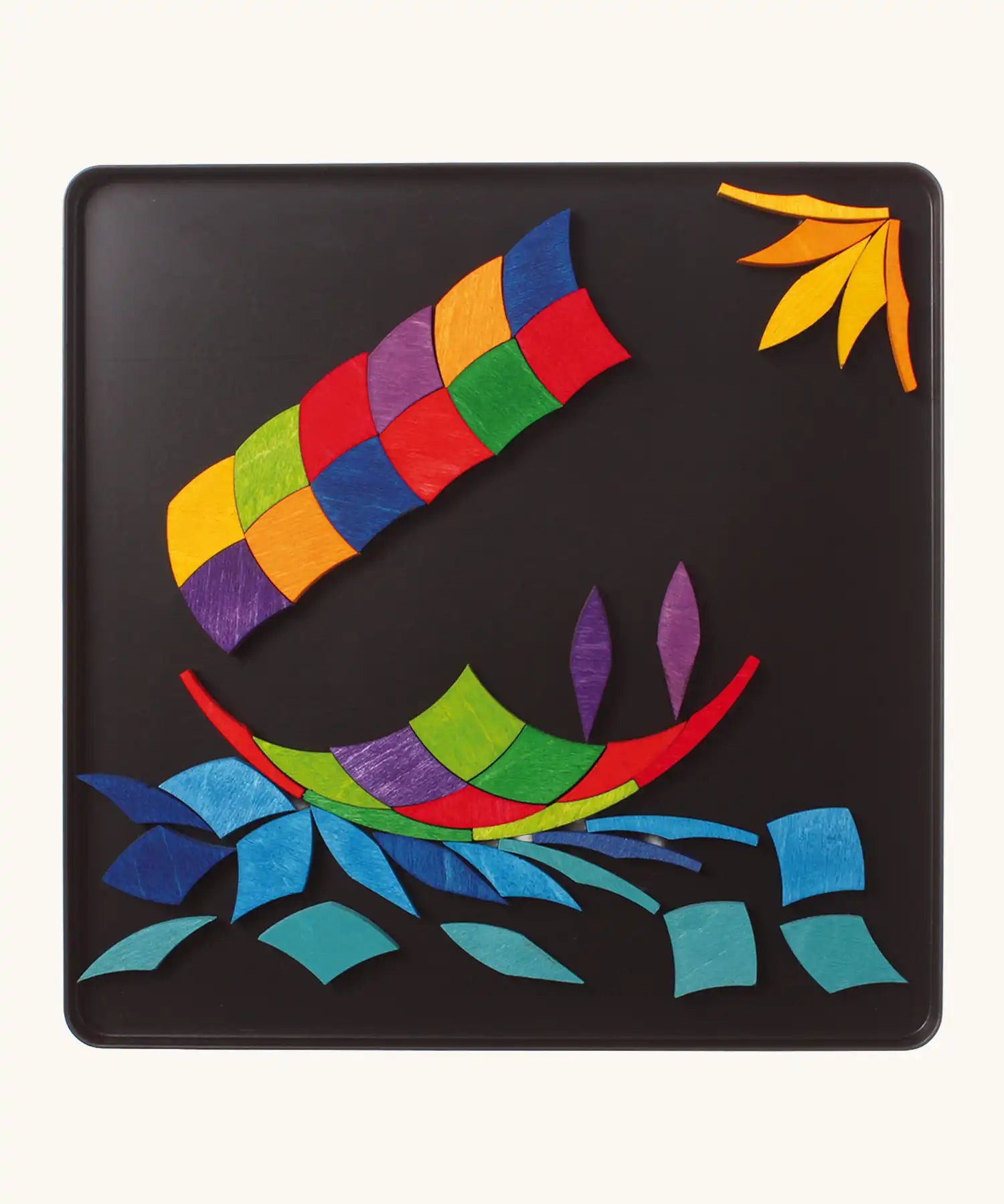 Grimm's colour spiral magnet puzzle used to create a boat scene.