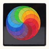 Grimm's colour spiral magnet puzzle in it's black metal tray.