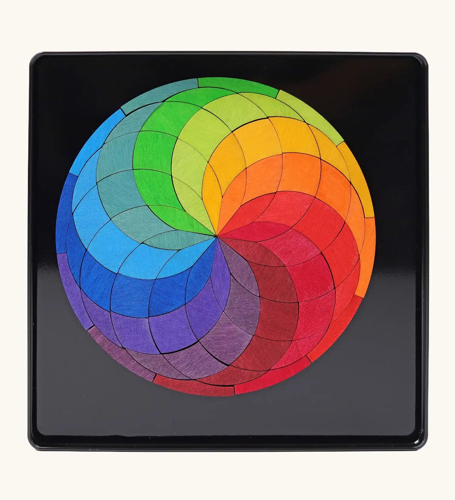 Grimm's colour spiral magnet puzzle in it's black metal tray.