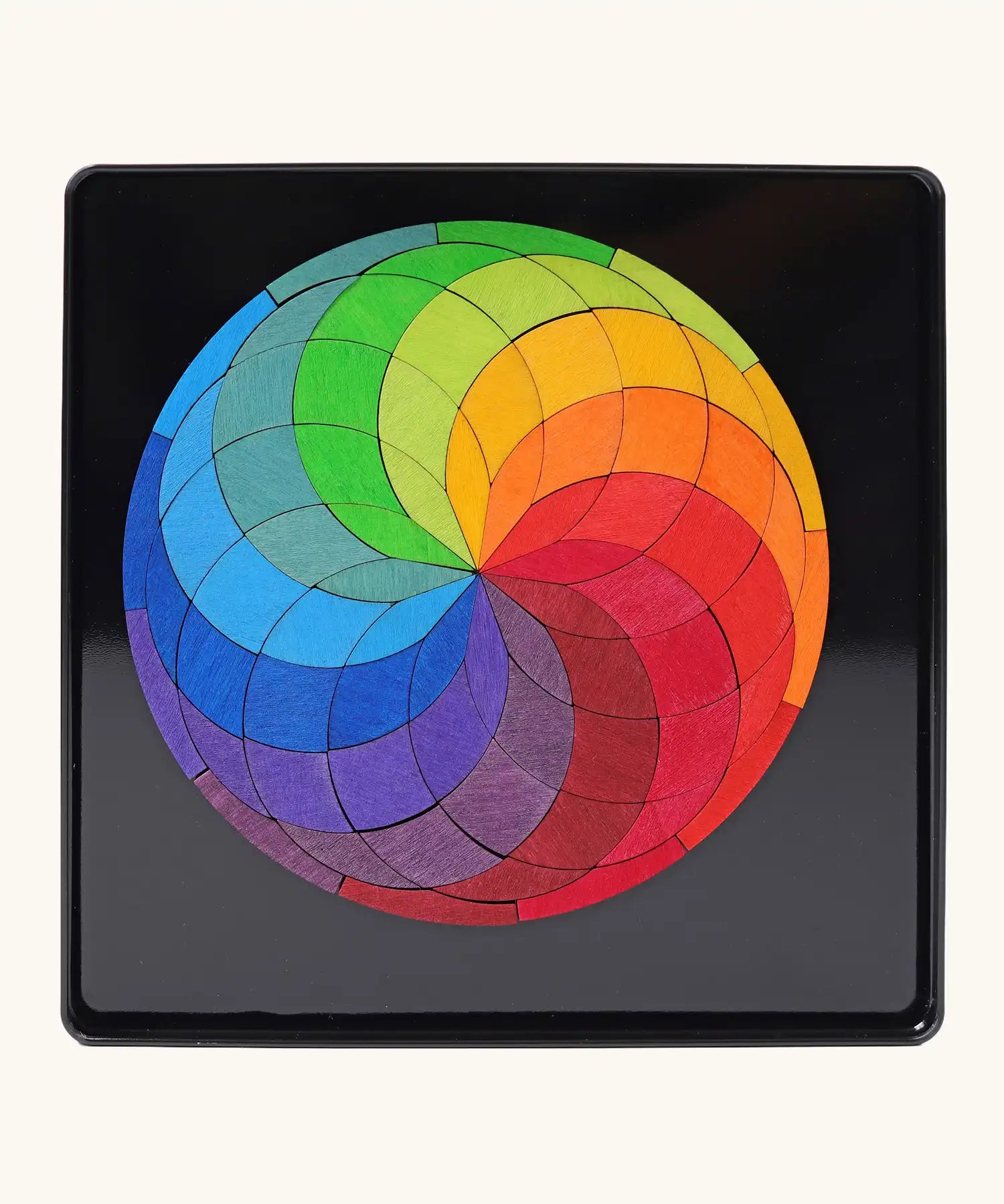 Grimm's colour spiral magnet puzzle in it's black metal tray.