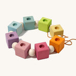 Grimm's Pastel Coloured Birthday Cubes Celebration Ring on a plain background. 