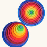 Grimm’s Concentric Circles & Rings stacked concentrically in a top-down view, showing the full rainbow colour sequence from teal centre to navy blue outer circle.