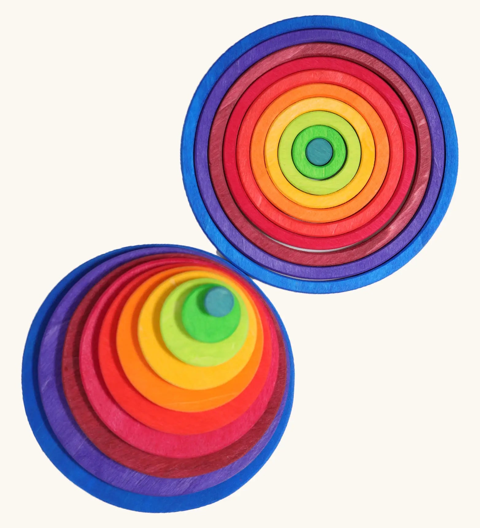 Grimm’s Concentric Circles & Rings stacked concentrically in a top-down view, showing the full rainbow colour sequence from teal centre to navy blue outer circle.
