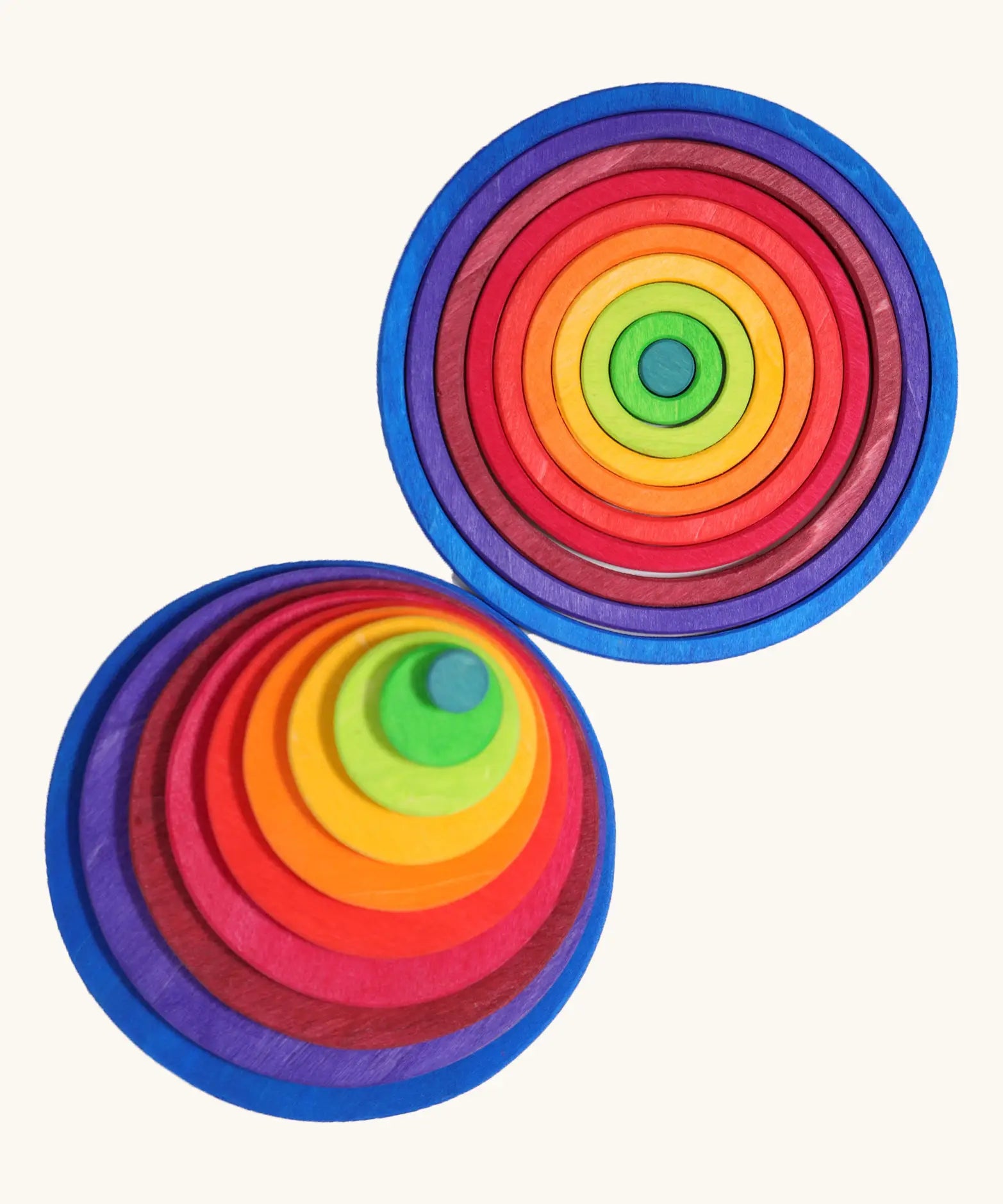 Grimm’s Concentric Circles & Rings stacked concentrically in a top-down view, showing the full rainbow colour sequence from teal centre to navy blue outer circle.