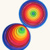 Grimm’s Concentric Circles & Rings stacked concentrically in a top-down view, showing the full rainbow colour sequence from teal centre to navy blue outer circle.