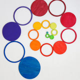 A swirl pattern made from the rings and disks of the Grimms concentric set in counting by colours palette