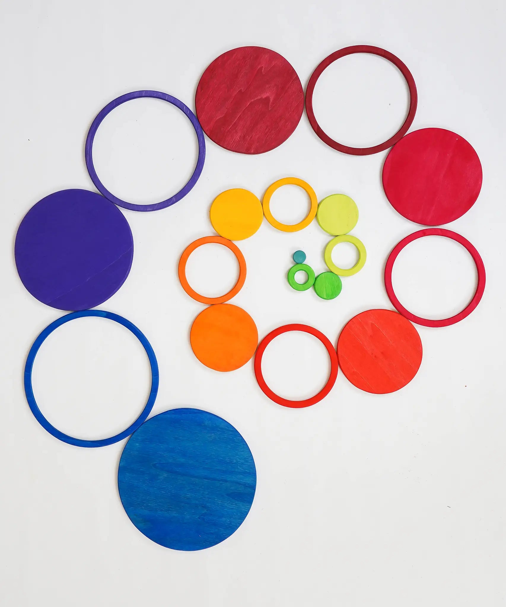 A swirl pattern made from the rings and disks of the Grimms concentric set in counting by colours palette