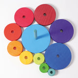 Overheard view of loose disk pieces and stand from the Grimms large conical tower in Grimm’s World of Numbers palette