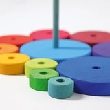 Loose disk pieces from the Grimms conical tower showing the hand cut detail and Grimm’s World of Numbers palette