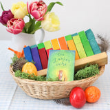 Grimms counting stack game displayed in a basket with a card game and flowers in the background