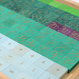 A Grimm's counting with colours educational block set showing second layer of blocks with numbers and symbols