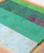 A Grimm's counting with colours educational block set showing second layer of blocks with numbers and symbols