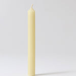 A close up of a single Grimms 100% beeswax candle showing the wick detail